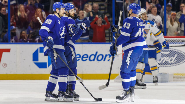 TAMPA, FL - DECEMBER 22: Anthony Cirelli #71 of the Tampa Bay Lightning celebrates a goal with teammates J.J. Moser #90 and Darren Raddysh #43 against the St. Louis Blues at Benchmark International Arena on December 22, 2025 in Tampa, Florida.