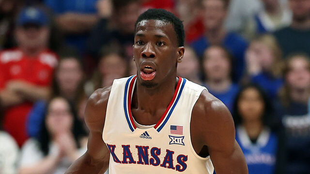 LAWRENCE, KANSAS - DECEMBER 22: Melvin Council Jr. #14 of the Kansas Jayhawks controls the ball during the game against the Davidson Wildcats at Allen Fieldhouse on December 22, 2025 in Lawrence, Kansas.