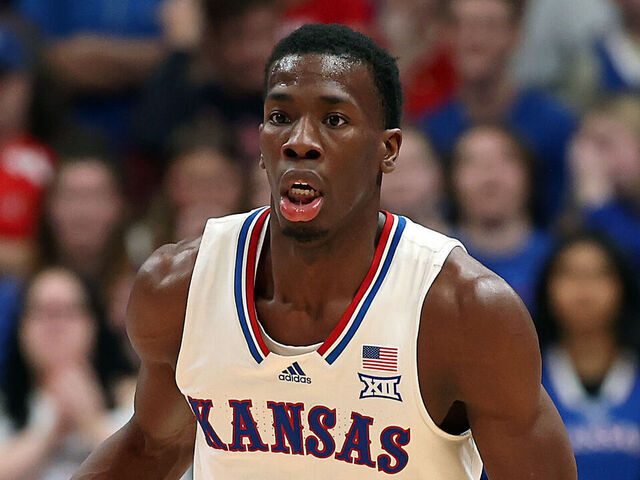LAWRENCE, KANSAS - DECEMBER 22: Melvin Council Jr. #14 of the Kansas Jayhawks controls the ball during the game against the Davidson Wildcats at Allen Fieldhouse on December 22, 2025 in Lawrence, Kansas.