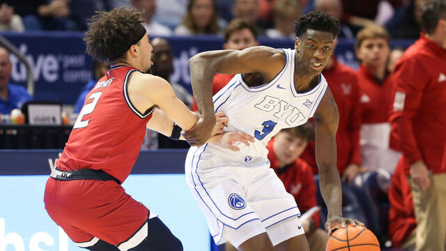PROVO, UT - DECEMBER 22: AJ Dybantsa #3 of the Brigham Young Cougars pushes past Isaiah Moses #2 of the Eastern Washington Eagles during the second half of their game at the Marriott Center on December 22, 2025 in Provo, Utah.