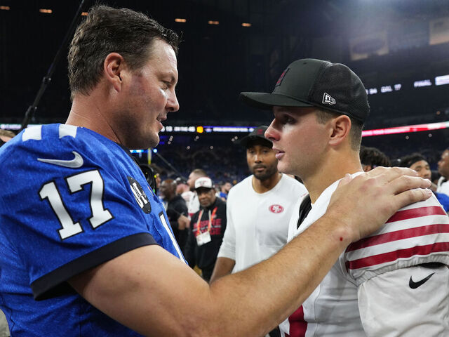 INDIANAPOLIS, INDIANA - DECEMBER 22: Philip Rivers #17 of the Indianapolis Colts and Brock Purdy #13 of the San Francisco 49ers shake hands after the game at Lucas Oil Stadium on December 22, 2025 in Indianapolis, Indiana.