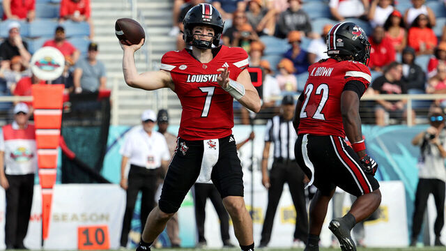 BOCA RATON, FLORIDA - DECEMBER 23: Miller Moss #7 of the Louisville Cardinals passes the ball against the Toledo Rockets during the first half of the 2025 Bush's Boca Raton Bowl of Beans game at Flagler Credit Union Stadium on December 23, 2025 in Boca Raton, Florida.