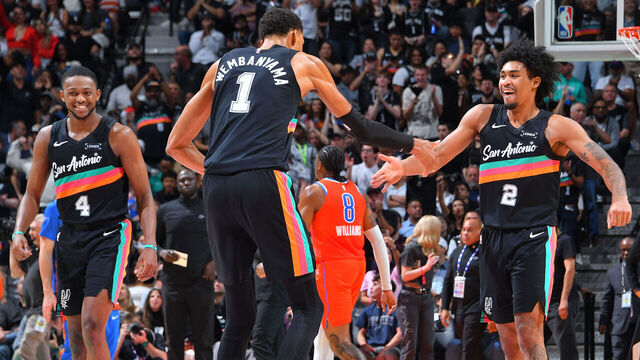SAN ANTONIO, TX - DECEMBER 23: Victor Wembanyama #1 high fives Dylan Harper #2 of the San Antonio Spurs during the game against the Oklahoma City Thunder on December 23, 2025 at the Frost Bank Center in San Antonio, Texas. Mandatory Copyright Notice: Copyright 2025 NBAE (Photos by Michael Gonzales/NBAE via Getty Images)