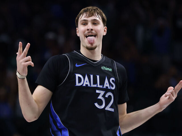DALLAS, TEXAS - DECEMBER 23: Cooper Flagg #32 of the Dallas Mavericks reacts after scoring a three point basket during the second half against the Denver Nuggets at American Airlines Center on December 23, 2025 in Dallas, Texas.