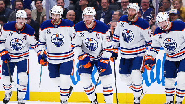 TORONTO, CANADA - DECEMBER 13: Connor McDavid #97 of the Edmonton Oilers celebrates with teammates Ryan Nugent-Hopkins #93, Evan Bouchard #2, Mattias Ekholm #14, and Zach Hyman #18 after scoring against against the Toronto Maple Leafs at Scotiabank Arena on December 13, 2025 in Toronto, Ontario, Canada.