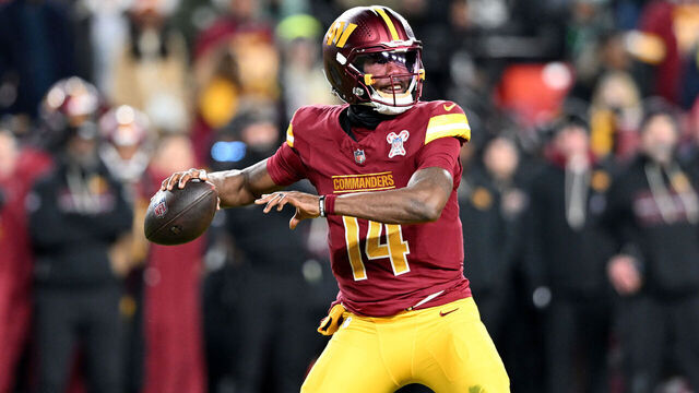 LANDOVER, MARYLAND - DECEMBER 20: Josh Johnson #14 of the Washington Commanders throws a pass against the Philadelphia Eagles at Northwest Stadium on December 20, 2025 in Landover, Maryland.