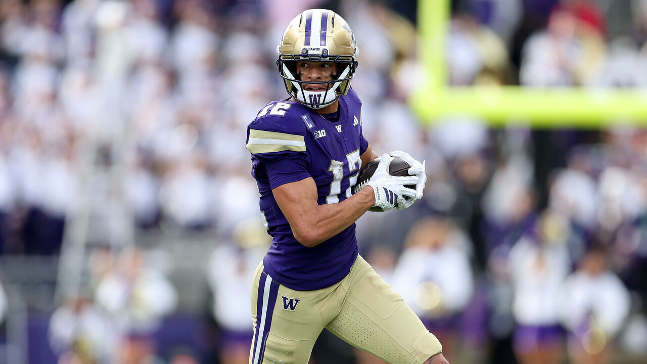 SEATTLE, WASHINGTON - OCTOBER 25: Denzel Boston #12 of the Washington Huskies carries the ball against the Illinois Fighting Illini during the second half at Husky Stadium on October 25, 2025 in Seattle, Washington.