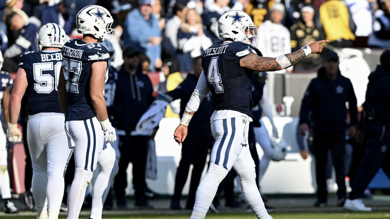LANDOVER, MARYLAND - DECEMBER 25: Dak Prescott #4 of the Dallas Cowboys reacts after throwing a touchdown pass against the Washington Commanders in the second quarter of a game at Northwest Stadium on December 25, 2025 in Landover, Maryland.