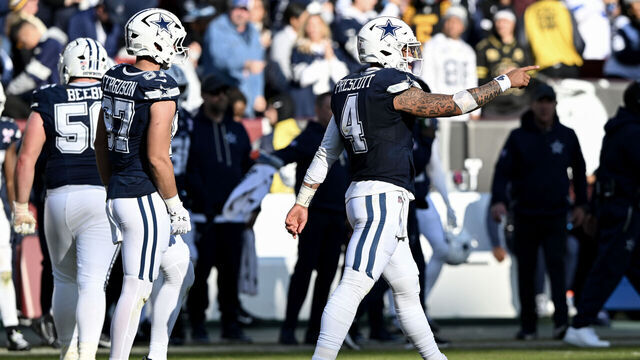 LANDOVER, MARYLAND - DECEMBER 25: Dak Prescott #4 of the Dallas Cowboys reacts after throwing a touchdown pass against the Washington Commanders in the second quarter of a game at Northwest Stadium on December 25, 2025 in Landover, Maryland.