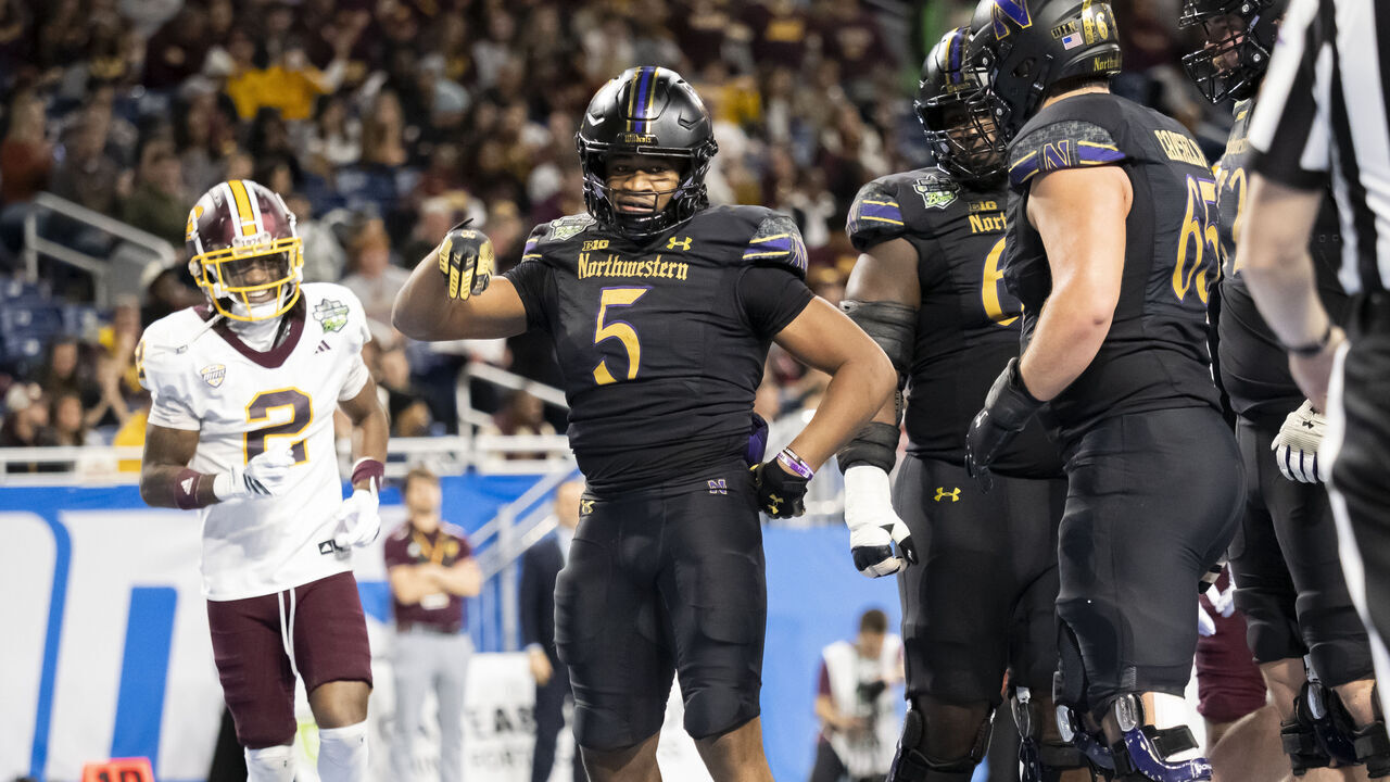 DETROIT, MI - DECEMBER 26: Northwestern Wildcats running back Caleb Komolafe (5) celebrates after running the ball for a touchdown during the GameAbove Sports Bowl between the Central Michigan Chippewas and the Northwestern Wildcats on December 26, 2025, at Ford Field in Detroit, Michigan.