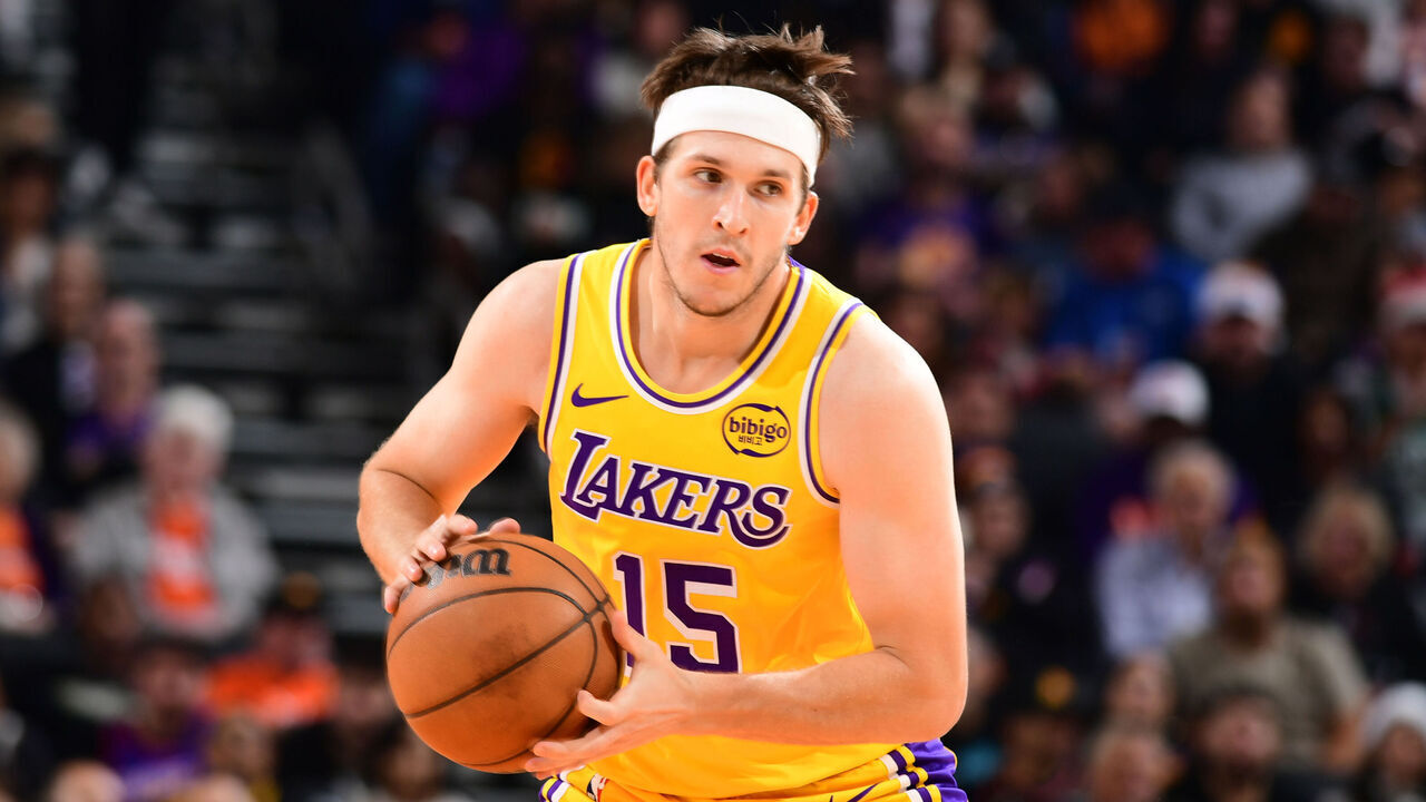 PHOENIX, AZ - DECEMBER 23: Austin Reaves #15 of the Los Angeles Lakers handles the ball during the game against the Phoenix Suns on December 23, 2025 at PHX Arena in Phoenix, Arizona. Mandatory Copyright Notice: Copyright 2025 NBAE