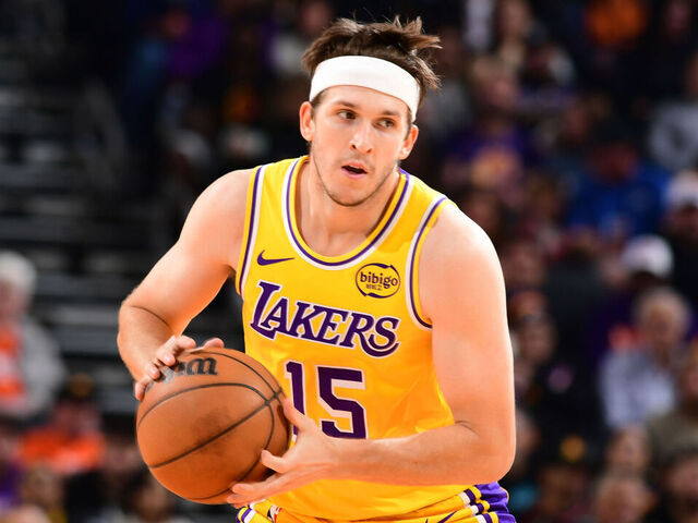 PHOENIX, AZ - DECEMBER 23: Austin Reaves #15 of the Los Angeles Lakers handles the ball during the game against the Phoenix Suns on December 23, 2025 at PHX Arena in Phoenix, Arizona. Mandatory Copyright Notice: Copyright 2025 NBAE
