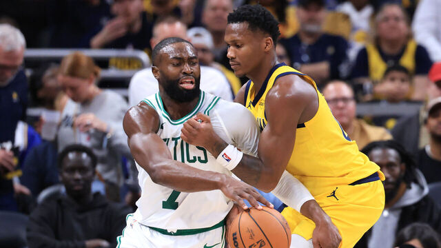 INDIANAPOLIS, INDIANA - DECEMBER 26: Jaylen Brown #7 of the Boston Celtics is fouled by Bennedict Mathurin #00 of the Indiana Pacers during the third quarter at Gainbridge Fieldhouse on December 26, 2025 in Indianapolis, Indiana.