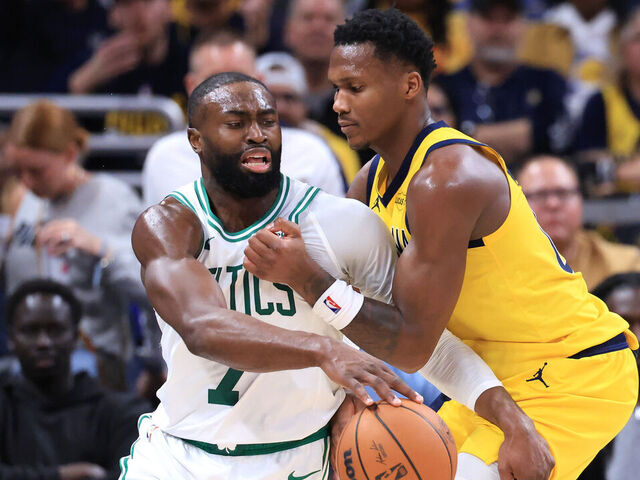 INDIANAPOLIS, INDIANA - DECEMBER 26: Jaylen Brown #7 of the Boston Celtics is fouled by Bennedict Mathurin #00 of the Indiana Pacers during the third quarter at Gainbridge Fieldhouse on December 26, 2025 in Indianapolis, Indiana.