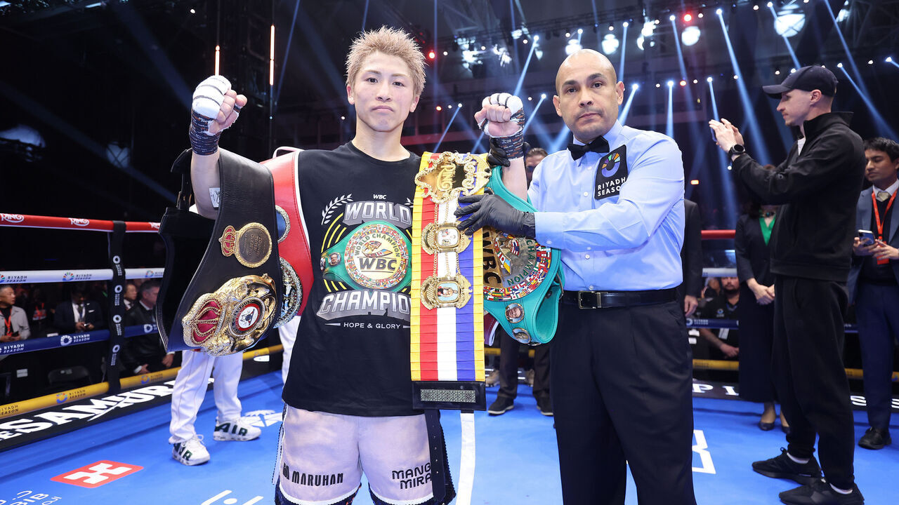 RIYADH, SAUDI ARABIA - DECEMBER 27: Naoya Inoue (pink shorts) celebrates after beating David Picasso in their Undisputed IBF, WBC, WBA and WBO World Super Bantamweight Title fight, during the Ring V: Night Of The Samurai fight night at Mohammed Abdo Arena on December 27, 2025 in Riyadh, Saudi Arabia. .