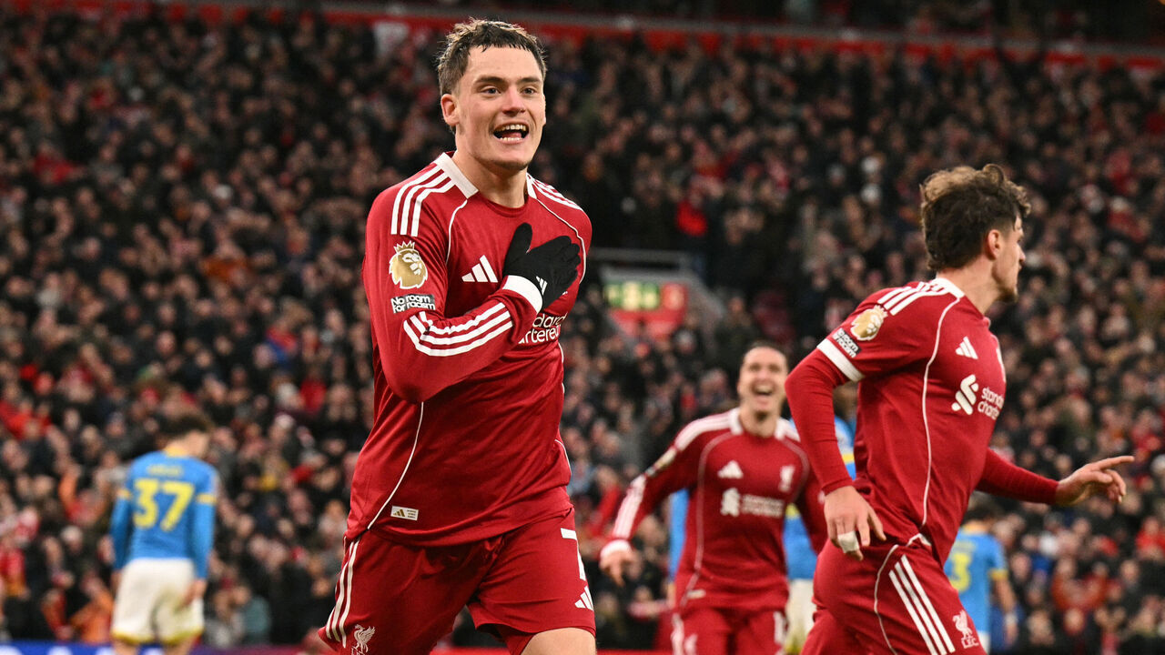 TOPSHOT - Liverpool's German midfielder #07 Florian Wirtz (C) celebrates after scoring their second goal during the English Premier League football match between Liverpool and Wolverhampton Wanderers at Anfield in Liverpool, north west England on December 27, 2025. / RESTRICTED TO EDITORIAL USE. No use with unauthorized audio, video, data, fixture lists, club/league logos or 'live' services. Online in-match use limited to 120 images. An additional 40 images may be used in extra time. No video emulation. Social media in-match use limited to 120 images. An additional 40 images may be used in extra time. No use in betting publications, games or single club/league/player publications. /