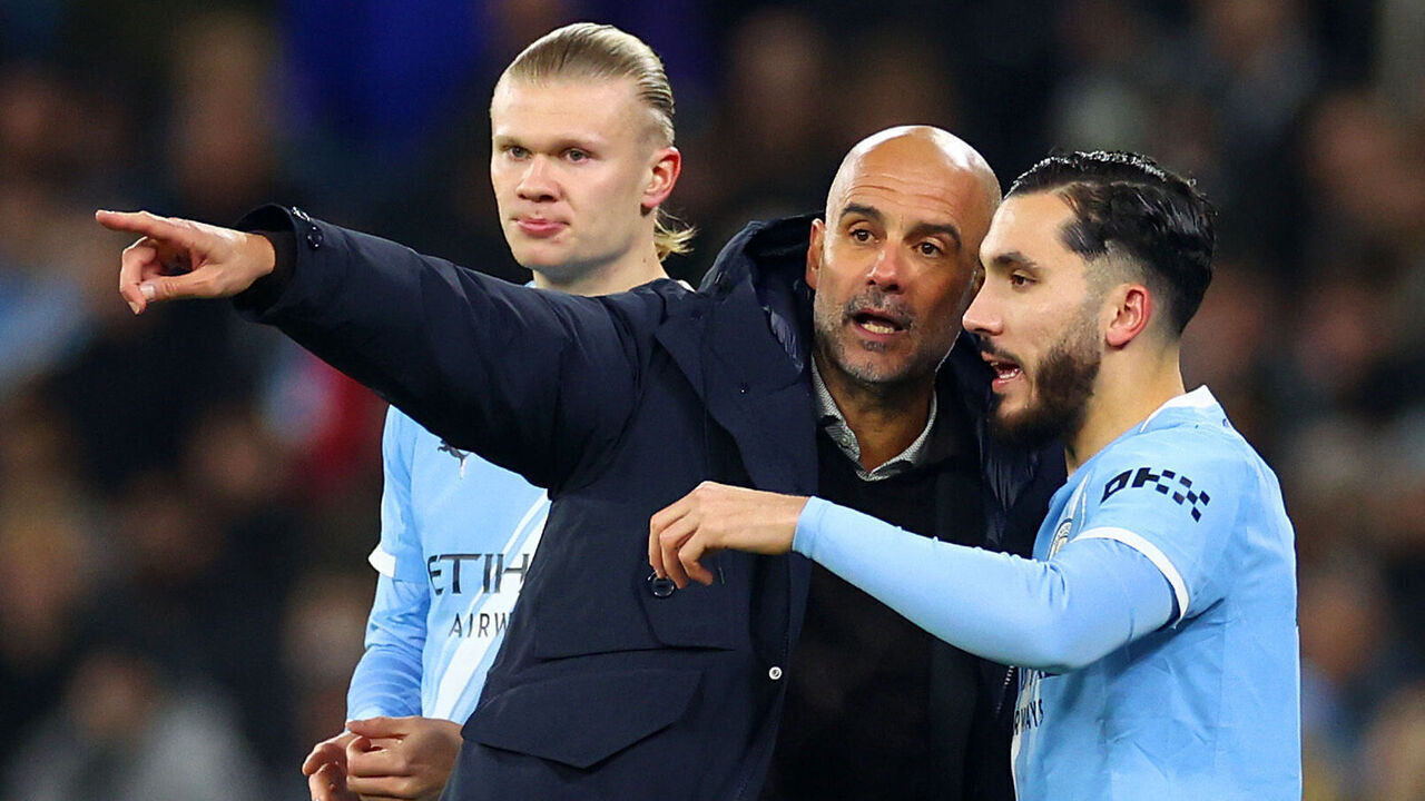 MANCHESTER, ENGLAND - NOVEMBER 25: Manchester City coach Josep Guardiola makes a point to Rayan Cherki during the UEFA Champions League 2025/26 League Phase MD5 match between Manchester City and Bayer 04 Leverkusen at City of Manchester Stadium on November 25, 2025 in Manchester, England.