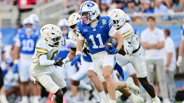 ORLANDO, FLORIDA - DECEMBER 27: Parker Kingston #11 of the BYU Cougars runs with the ball in the first half against the Georgia Tech Yellow Jackets during the 2025 Pop-Tarts Bowl at Camping World Stadium on December 27, 2025 in Orlando, Florida.