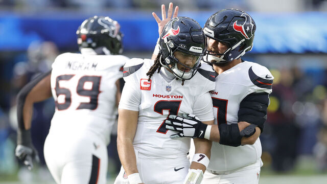 INGLEWOOD, CALIFORNIA - DECEMBER 27: C.J. Stroud #7 celebrates a touchdown pass with Jake Andrews #60 of the Houston Texans during the first quarter against the Los Angeles Chargers at SoFi Stadium on December 27, 2025 in Inglewood, California.