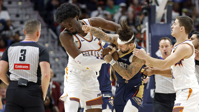 NEW ORLEANS, LOUISIANA - DECEMBER 27: Jose Alvarado #15 of the New Orleans Pelicans gets into a scrum with Mark Williams #15 of the Phoenix Suns during the second half of a game at Smoothie King Center on December 27, 2025 in New Orleans, Louisiana.