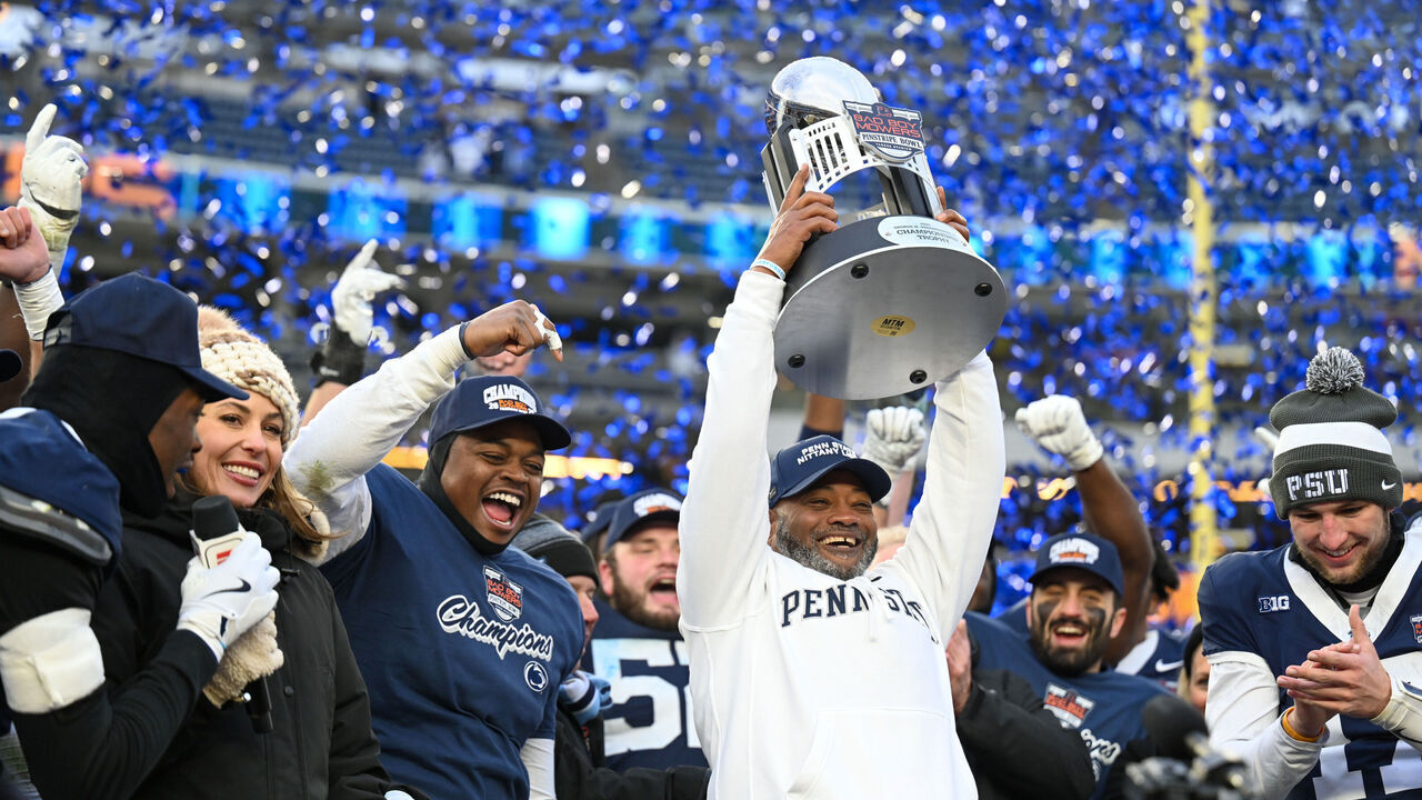 NEW YORK, NEW YORK - DECEMBER 27: Penn State Nittany Lions Interim Head Coach Terry Smith holds up the Pinstripe Bowl Trophy after the 2025 Bad Boy Mowers Pinstripe Bowl between the Penn State Nittany Lions and the Clemson Tigers at Yankee Stadium on December 27, 2025 in New York City.
