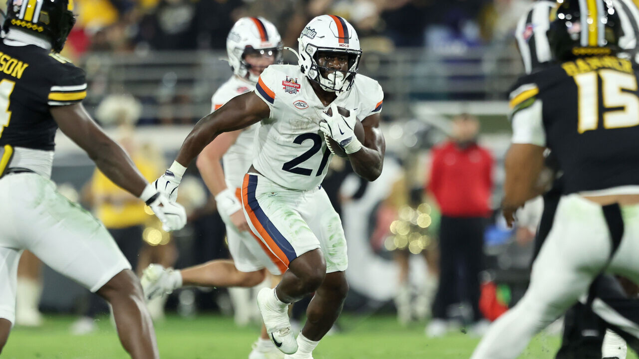 JACKSONVILLE, FLORIDA - DECEMBER 27: Harrison Waylee #21 of the Virginia Cavaliers runs the ball in the second quarter of the 2025 TaxSlayer Gator Bowl between the Missouri Tigers and Virginia Cavaliers at EverBank Stadium on December 27, 2025 in Jacksonville, Florida.