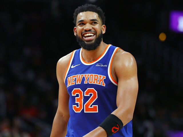 ATLANTA, GEORGIA - DECEMBER 27: Karl-Anthony Towns #32 of the New York Knicks reacts after a three pointer during the fourth quarter against the Atlanta Hawks at State Farm Arena on December 27, 2025 in Atlanta, Georgia.