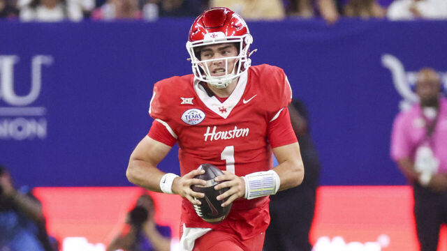 HOUSTON, TX - DECEMBER 27: Houston Cougars quarterback Conner Weigman (1) carries the ball in the first quarter during the Kinder's Texas Bowl between the LSU Tigers and Houston Cougars on December 27,2025 at NRG Stadium in Houston, Texas.