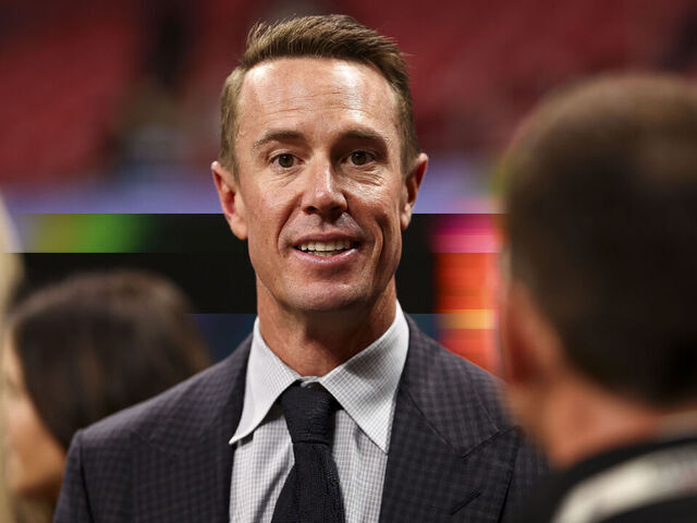 ATLANTA, GEORGIA - OCTOBER 3: Former Atlanta Falcons quarterback Matt Ryan smiles on the sidelines prior to an NFL football game against the Tampa Bay Buccaneers at Mercedes-Benz Stadium on October 3, 2024 in Atlanta, Georgia.