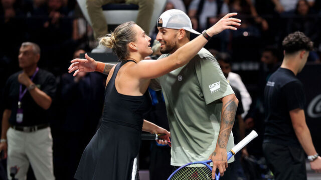 Belarus' Aryna Sabalenka and Australia's Nick Kyrgios embrace at the net after the Battle of the Sexes tennis match at the Coca-Cola Arena in Dubai on December 28, 2025.