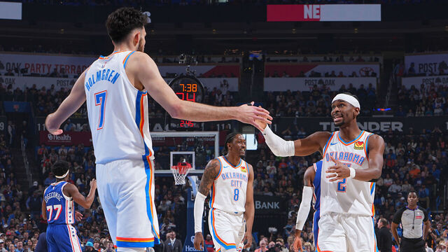 OKLAHOMA CITY, OK - DECEMBER 28: Chet Holmgren #7 and Shai Gilgeous-Alexander #2 of the Oklahoma City Thunder high five during the game against the Philadelphia 76ers on December 28, 2025 at Paycom Center in Oklahoma City, Oklahoma. Mandatory Copyright Notice: Copyright 2025 NBAE