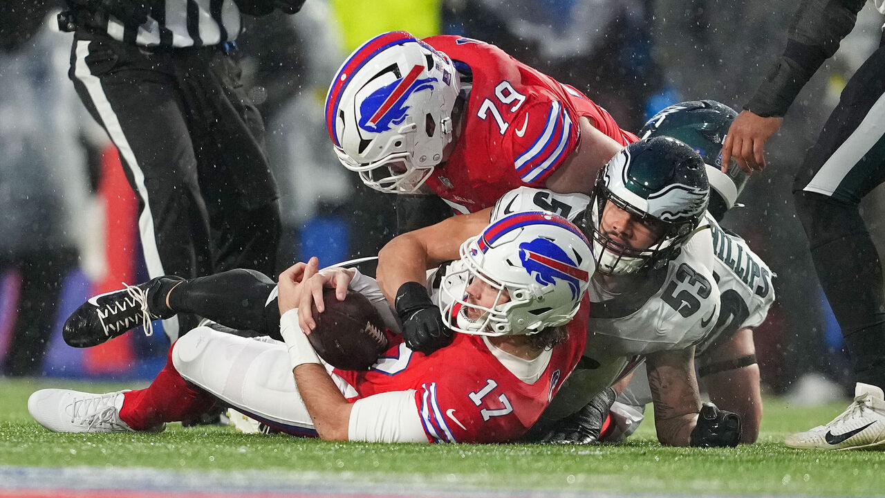 ORCHARD PARK, NEW YORK - DECEMBER 28: Josh Allen #17 of the Buffalo Bills is tackled by Zack Baun #53 of the Philadelphia Eagles during the first quarter of the game at Highmark Stadium on December 28, 2025 in Orchard Park, New York.