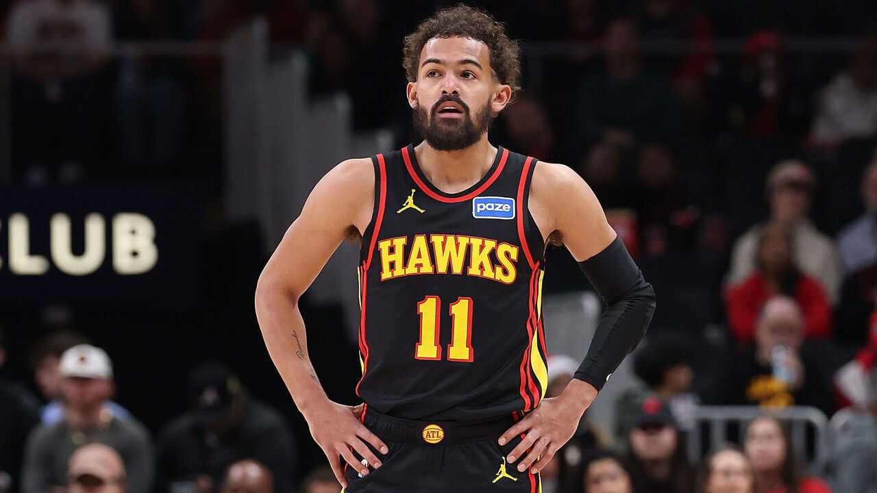 ATLANTA, GEORGIA - DECEMBER 21: Trae Young #11 of the Atlanta Hawks looks on against the Chicago Bulls during the first quarter at State Farm Arena on December 21, 2025 in Atlanta, Georgia.