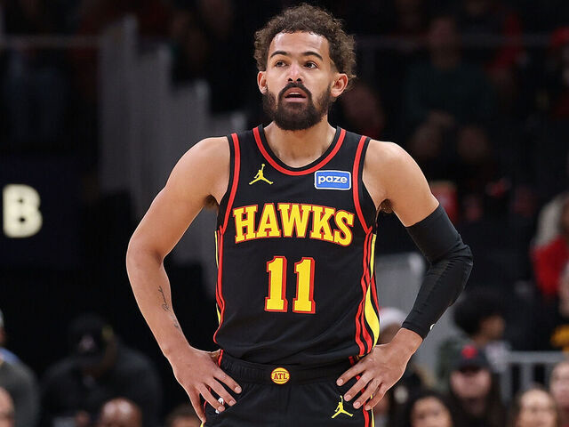 ATLANTA, GEORGIA - DECEMBER 21: Trae Young #11 of the Atlanta Hawks looks on against the Chicago Bulls during the first quarter at State Farm Arena on December 21, 2025 in Atlanta, Georgia.