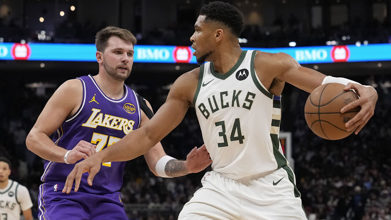 MILWAUKEE, WISCONSIN - NOVEMBER 15: Giannis Antetokounmpo #34 of the Milwaukee Bucks dribbles the ball against Luka Doncic #77 of the Los Angeles Lakers during the third quarter at Fiserv Forum on November 15, 2025 in Milwaukee, Wisconsin.