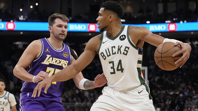MILWAUKEE, WISCONSIN - NOVEMBER 15: Giannis Antetokounmpo #34 of the Milwaukee Bucks dribbles the ball against Luka Doncic #77 of the Los Angeles Lakers during the third quarter at Fiserv Forum on November 15, 2025 in Milwaukee, Wisconsin.
