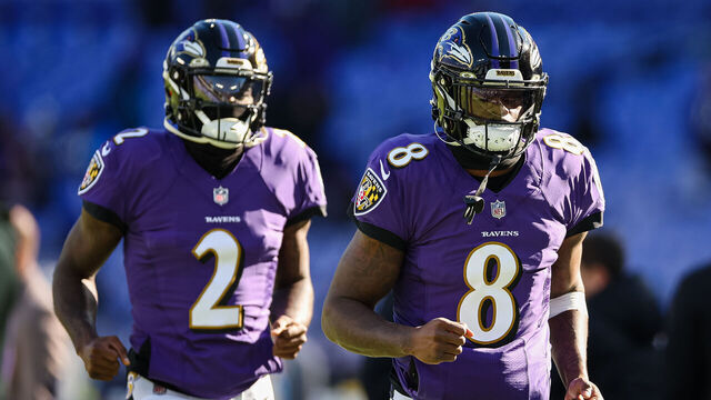 BALTIMORE, MD - NOVEMBER 20: Lamar Jackson #8 and Tyler Huntley #2 of the Baltimore Ravens take the field before the game against the Carolina Panthers at M&T Bank Stadium on November 20, 2022 in Baltimore, Maryland.