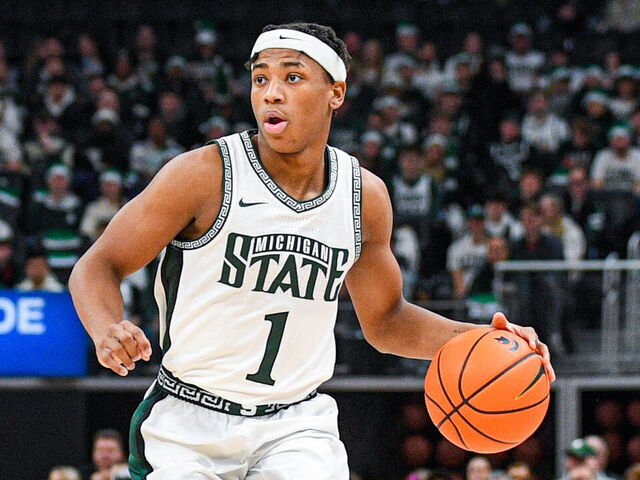 DETROIT, MICHIGAN - DECEMBER 20: Jeremy Fears Jr. #1 of the Michigan State Spartans dribbles the ball up court during the first half of the college basketball game against the Oakland Golden Grizzlies at Little Caesars Arena on December 20, 2025 in Detroit, Michigan. The Michigan State Spartans won the game 79-70.