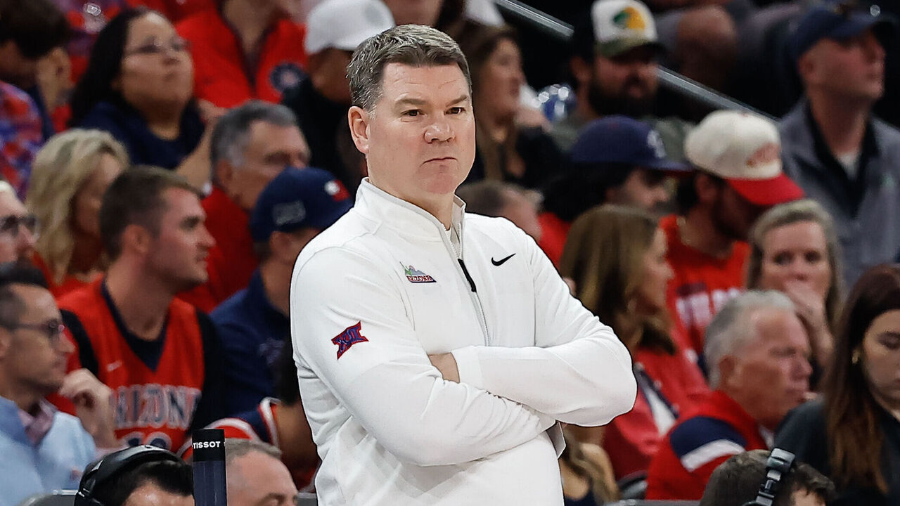 PHOENIX, AZ - DECEMBER 20: Arizona Wildcats head coach Tommy Lloyd looks on during the Hall of Fame Series college basketball game between the Arizona Wildcats and the San Diego State Aztecs on December 20, 2025 at Mortgage Matchup Center in Phoenix, Arizona.