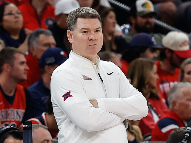 PHOENIX, AZ - DECEMBER 20: Arizona Wildcats head coach Tommy Lloyd looks on during the Hall of Fame Series college basketball game between the Arizona Wildcats and the San Diego State Aztecs on December 20, 2025 at Mortgage Matchup Center in Phoenix, Arizona.