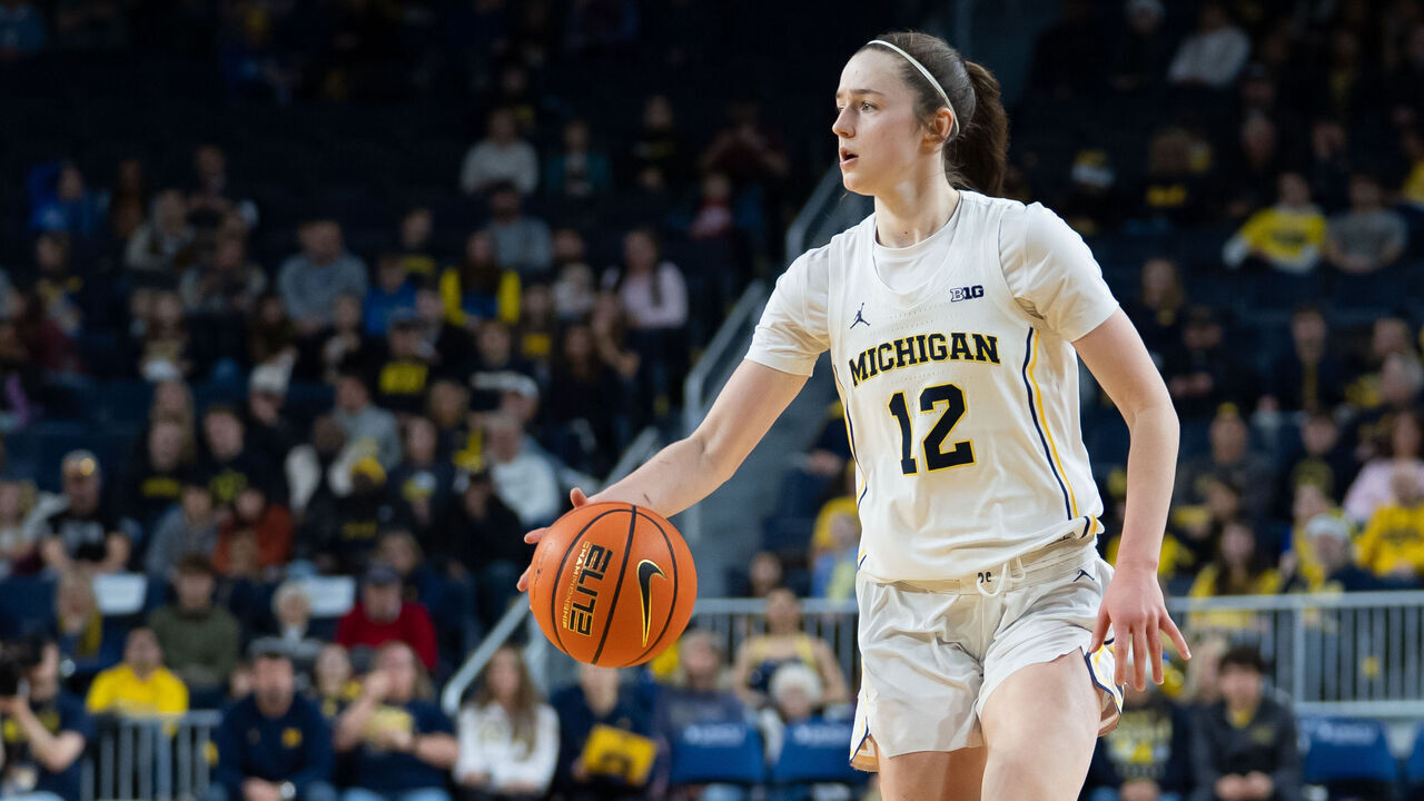 ANN ARBOR, MICHIGAN - DECEMBER 21: Syla Swords #12 of the Michigan Wolverines brings the ball up court during the second quarter against the Oakland Golden Grizzlies at Crisler Arena on December 21, 2025 in Ann Arbor, Michigan.