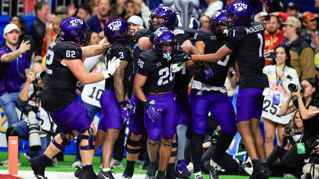 SAN ANTONIO, TX - DECEMBER 30: Texas Christian University Horned Frogs running back Jeremy Payne (26) gets congratulated by the team after scoring a touchdown against the Southern California Trojans during the Valero Alamo Bowl football game at the Alamodome on December 30, 2025 in San Antonio, TX.