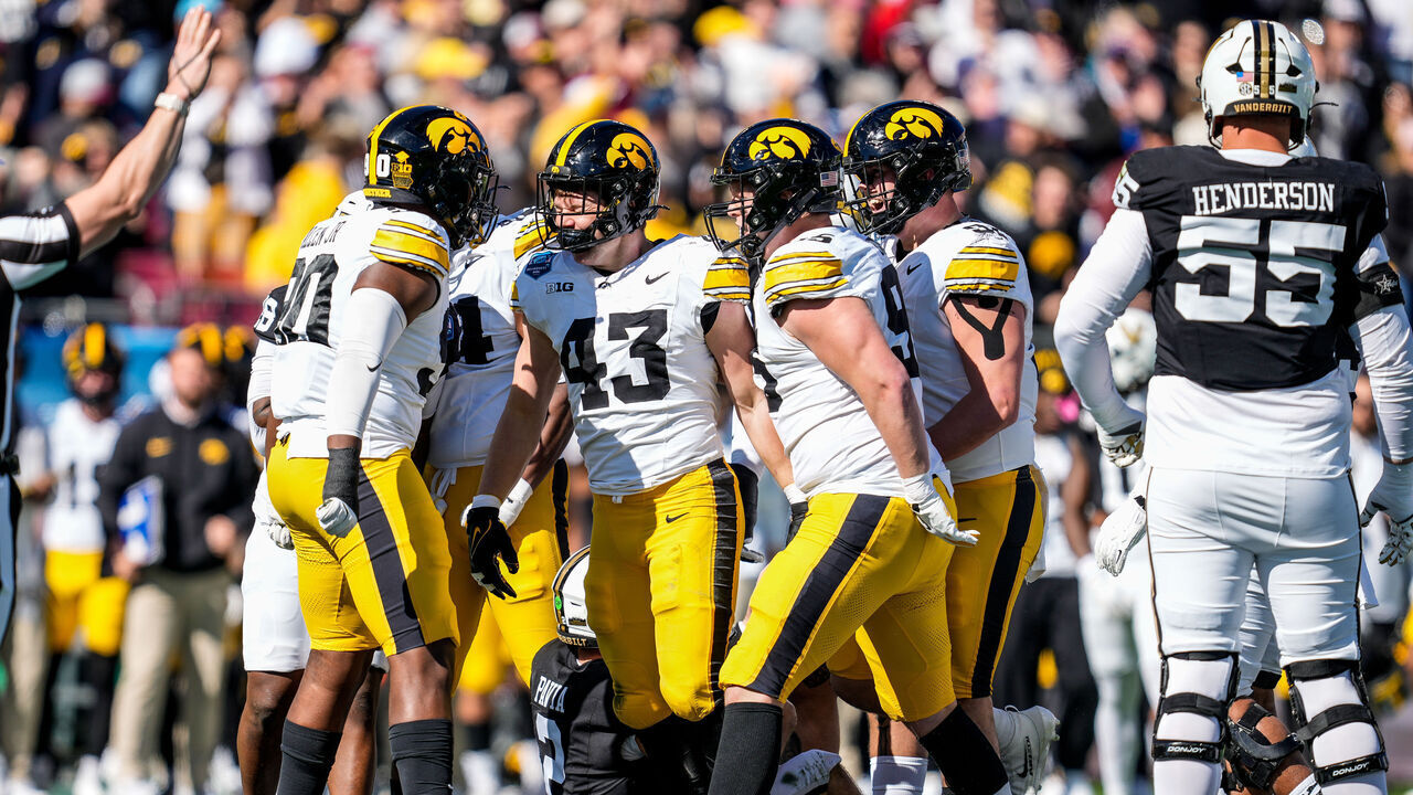 TAMPA, FL - DECEMBER 31: Iowa Hawkeyes linebacker Karson Sharar (43) celebrates with teammates after a sack during the Reliaquest Bowl between the Iowa Hawkeyes and the Vanderbilt Comodores, December 31, 2025 at Raymond James Stadium in Tampa, Florida