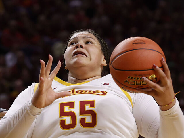 AMES, IA - DECEMBER 10: Center Audi Crooks #55 of the Iowa State Cyclones rebounds the ball in the first half of play at Hilton Coliseum on December 10, 2025, in Ames, Iowa. The Iowa State Cyclones won 74-69 over the Iowa Hawkeyes.