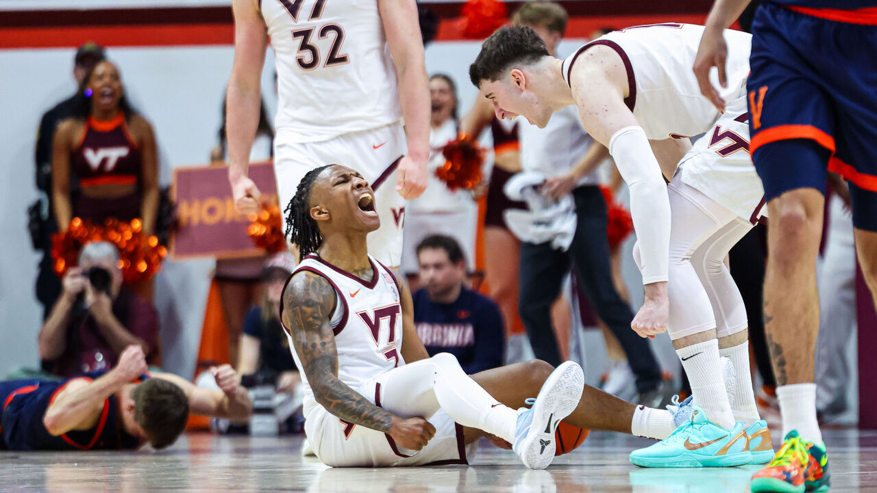 BLACKSBURG, VIRGINIA - DECEMBER 31: Ben Hammond #3 reacts with Neoklis Avdalas #17 of the Virginia Tech Hokies in overtime against the Virginia Cavaliers at Cassell Coliseum on December 31, 2025 in Blacksburg, Virginia.