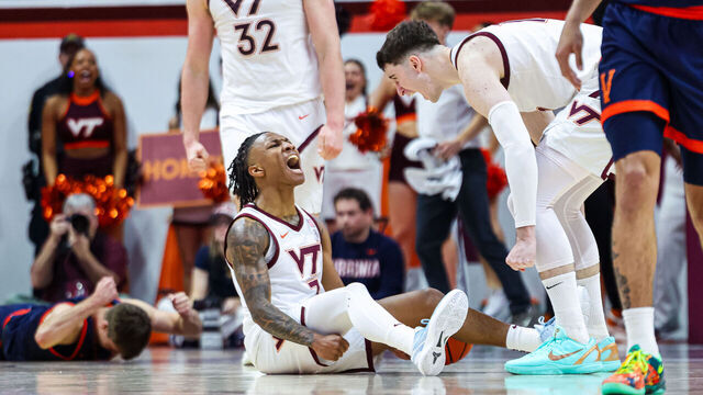 BLACKSBURG, VIRGINIA - DECEMBER 31: Ben Hammond #3 reacts with Neoklis Avdalas #17 of the Virginia Tech Hokies in overtime against the Virginia Cavaliers at Cassell Coliseum on December 31, 2025 in Blacksburg, Virginia.