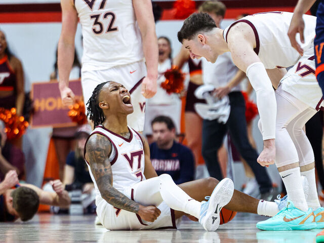 BLACKSBURG, VIRGINIA - DECEMBER 31: Ben Hammond #3 reacts with Neoklis Avdalas #17 of the Virginia Tech Hokies in overtime against the Virginia Cavaliers at Cassell Coliseum on December 31, 2025 in Blacksburg, Virginia.