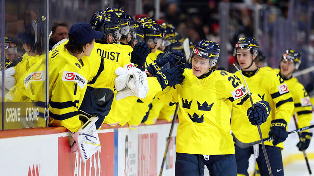 ST PAUL, MINNESOTA - DECEMBER 31: Casper Juustovaara #29 of Sweden celebrates his goal against the United States with teammates in the first period of a Group A stage game during the IIHF World Junior Hockey Championship at Grand Casino Arena on December 31, 2025 in St Paul, Minnesota.