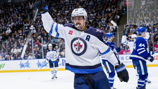 TORONTO, CANADA - JANUARY 1: Mark Scheifele #55 of the Winnipeg Jets celebrates after scoring a goal against the Toronto Maple Leafs during the third period at the Scotiabank Arena on January 1, 2026 in Toronto, Ontario, Canada.