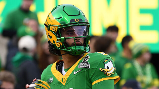 EUGENE, OR - DECEMBER 20: Oregon Ducks quarterback Dante Moore (5) warms up before the College Football Playoff first round game between the Oregon Ducks and James Madison Dukes on December 20, 2025 at Autzen Stadium in Eugene, Oregon.